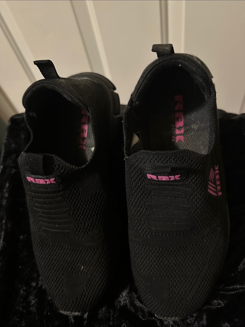 RBX Women's Black Knit Slip-On Sneakers with Pink Logo